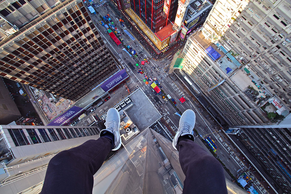 picture of man on roof of skyscraper for article